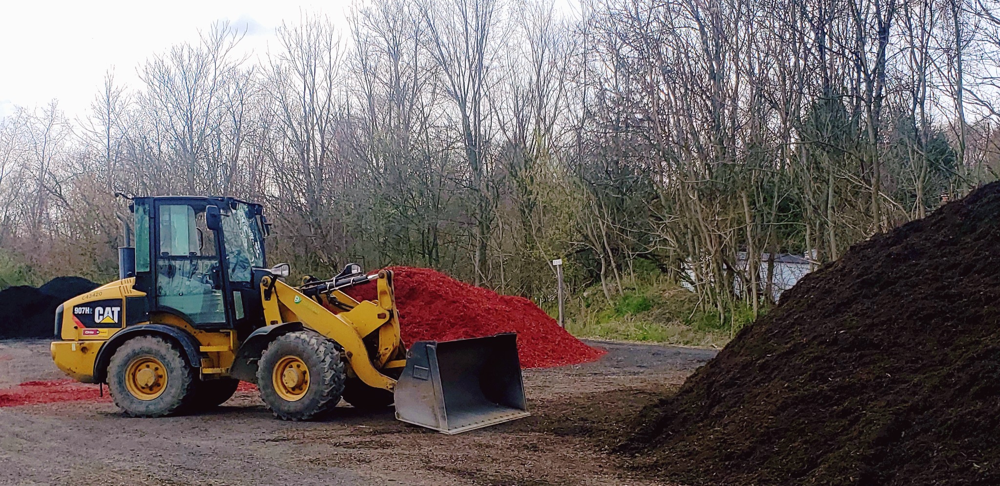 Loader and mulch piles at Rittman Landscape Supply
